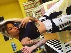 Who Has a Marijuana Leaf Tattooed on Her Butt Rolls Around All Sexy and Takes Daring Photos